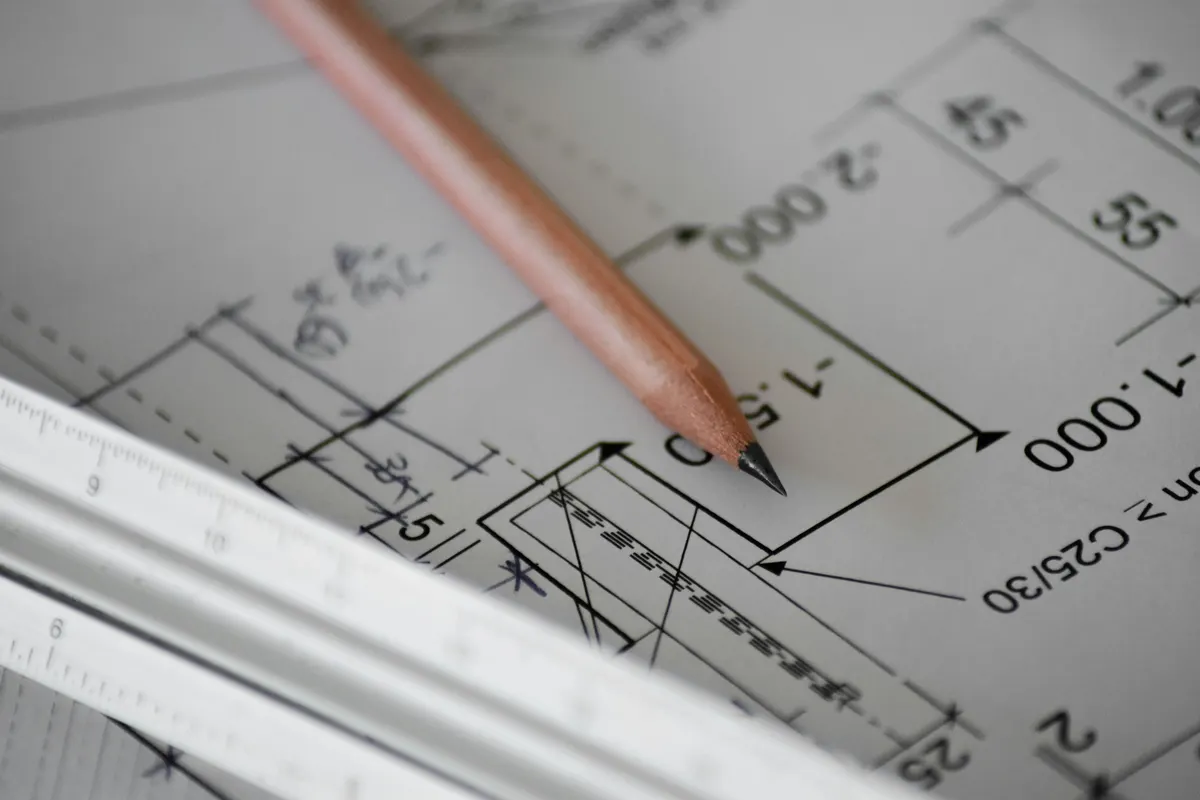 Close-up of architectural drawings representing campaign creative direction