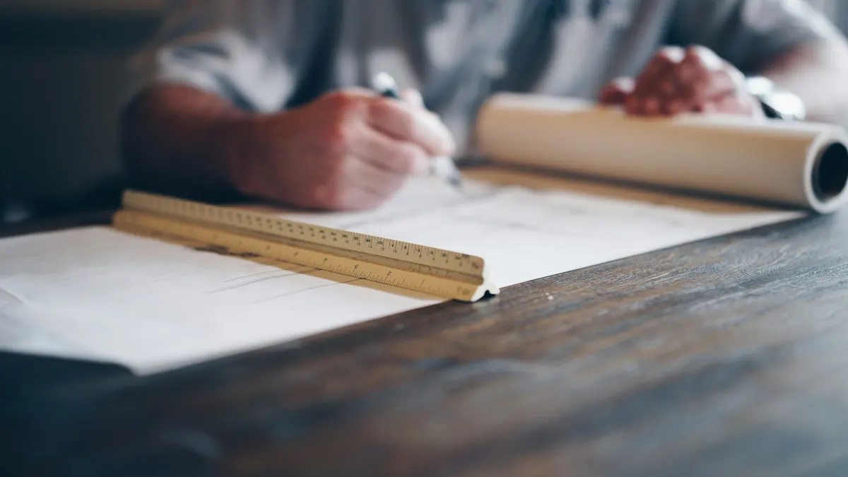 Detailed architectural blueprint workspace used to plan construction marketing strategy